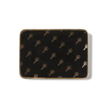 Top view of the black and gold ceramic Oscars logo accessory tray with gold trim edges.